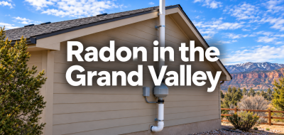 Exterior house with a radon mitigation pipe and fan, overlaid with the words Radon in the Grand Valley.